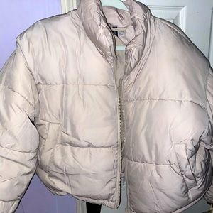 This is a sand colored puffer coat from H&M! Crop fitted & brand new